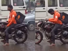 A viral video of a Swiggy delivery person waiting at a traffic light sans a raincoat Viral