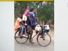 In a strange video going viral, a man rides a bicycle with 9 kids