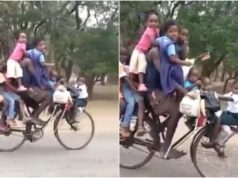 Watch this viral video of a man riding a bicycle with nine children from beginning to end